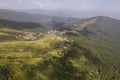 Green forest with fir trees and a meadow near the mountain village Dragobrat, Western Ukraine, Europe Royalty Free Stock Photo