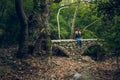 Green forest scenery landscape and small abandoned stone bridge