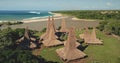 Green forest, traditional houses village on ocean sand shore aerial view. Tropical nature landscape Royalty Free Stock Photo