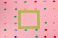 green frame as copy space on pink background, creative art modern design, fake gemstone rain Royalty Free Stock Photo
