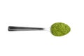 Green freeze dried wheatgrass powder in steel teaspoon isolated on white Royalty Free Stock Photo