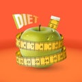 Green fresh apple with yellow measuring tape. Diet Royalty Free Stock Photo