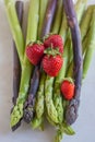 Green fresh asparagus with a bunch of healthy strawberries Royalty Free Stock Photo