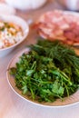 Green fresh bunch of parsley and dill lying on the plate for decoration of dishes Royalty Free Stock Photo