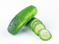 Green fresh cucumbers on a white background.
