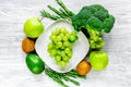 Green fresh food for fitness diet on gray wooden table background top view Royalty Free Stock Photo