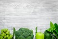 Green fresh food for fitness diet on gray wooden table background top view mock up Royalty Free Stock Photo