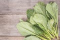 Green fresh Gai lan (Chinese broccoli) on wooden plank Royalty Free Stock Photo