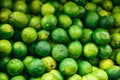 Green fresh lime background. Natural local products on the farm market. Royalty Free Stock Photo