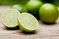 Green fresh lime on wooden table macro closeup outdoor Royalty Free Stock Photo