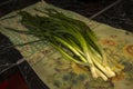 Green fresh onion bunches on tabel