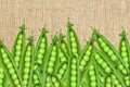 Green fresh peas over burlap background Royalty Free Stock Photo