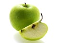 Green fresh ripe apple with a slice Royalty Free Stock Photo