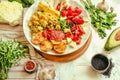 Green fresh salad with tomatoes, pink lentil mashed potatoes, baked potato slices with homemade ketchup.Full meal and Healthy