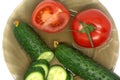 Green fresh sliced cucumber and tomato on glass plate Royalty Free Stock Photo