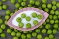 Green fresh sour plums and salt in the dish, sour plums with salt Royalty Free Stock Photo