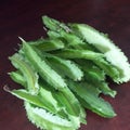 Green fresh winged winged fruit on a table on a brown background