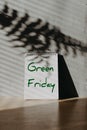 Green Friday banner with notepad and leaves shadows. Make Friday Green Again. Overproduction contributes environmental problems