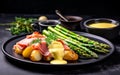 green fried asparagus, bacon, and fried potatoes with mustard sauce on a white plate.