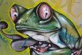 A green frog with funny eyes graffiti