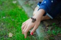 Green frog sitting on little girl hand. Child holding frog in th Royalty Free Stock Photo