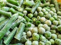 Green frozen beans and peas. Closeup frozen cut green french bean, haricot vert. Vegetable food background, healthy vegetarian