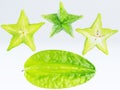 Green fruit of a carambola or starfruit starfruit on a white b