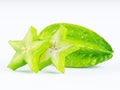 Green fruit of a carambola or starfruit starfruit on a white b