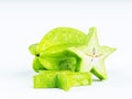 Green fruit of a carambola or starfruit starfruit on a white b