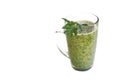 Green fruit and vegetable smoothie with a sprig of parsley in a transparent glass mug on a white background. healthy diet. food Royalty Free Stock Photo