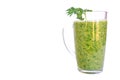Green fruit and vegetable smoothie with a sprig of parsley in a transparent glass mug on a white background. healthy diet. food Royalty Free Stock Photo