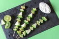 Green fruits on sticks and yogurt dip. Above view of vegetarian Royalty Free Stock Photo