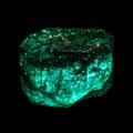 Green gachala emerald isolated on a black background