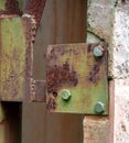 Green Galvanized Bolt on Rusty Steel Metal