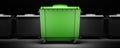 Green garbage container among gray containers isolated Royalty Free Stock Photo