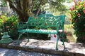 Green Garden bench in the park flower colorful image background Royalty Free Stock Photo