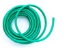 Green garden hose on white background Royalty Free Stock Photo