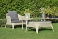 Green garden with an outdoor furniture lounge group