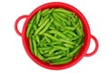 Green garden peas in red colander Royalty Free Stock Photo