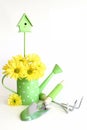 Green Gardening Tools with Yellow Flowers