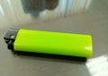 green gas lighter on the table Royalty Free Stock Photo