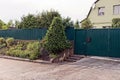 The green gate and the gate to the iron fences along the street Royalty Free Stock Photo