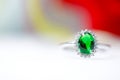 Green gemstone rings placed on beautiful floors Royalty Free Stock Photo
