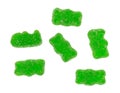 Green generic sugar coated gummy bears on a white background