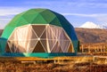 Green geo-dome tent on Kamchatka peninsula. Cozy, camping, glamping, holiday, vacation lifestyle concept. Outdoors cabin