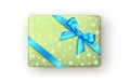 Green gift box with  blue ribbon and bow, top view Royalty Free Stock Photo