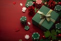 A green gift box with a bow sits atop a vibrant red table, set for a celebration or special occasion Royalty Free Stock Photo