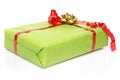 Green gift box with a red ribbon and a golden bow Royalty Free Stock Photo