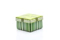 A green gift box with white strip