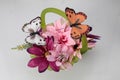 green glass basket with pink and purple flowers, and butterflies (spring collection) Royalty Free Stock Photo